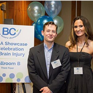 more people smiling in font of the balloons